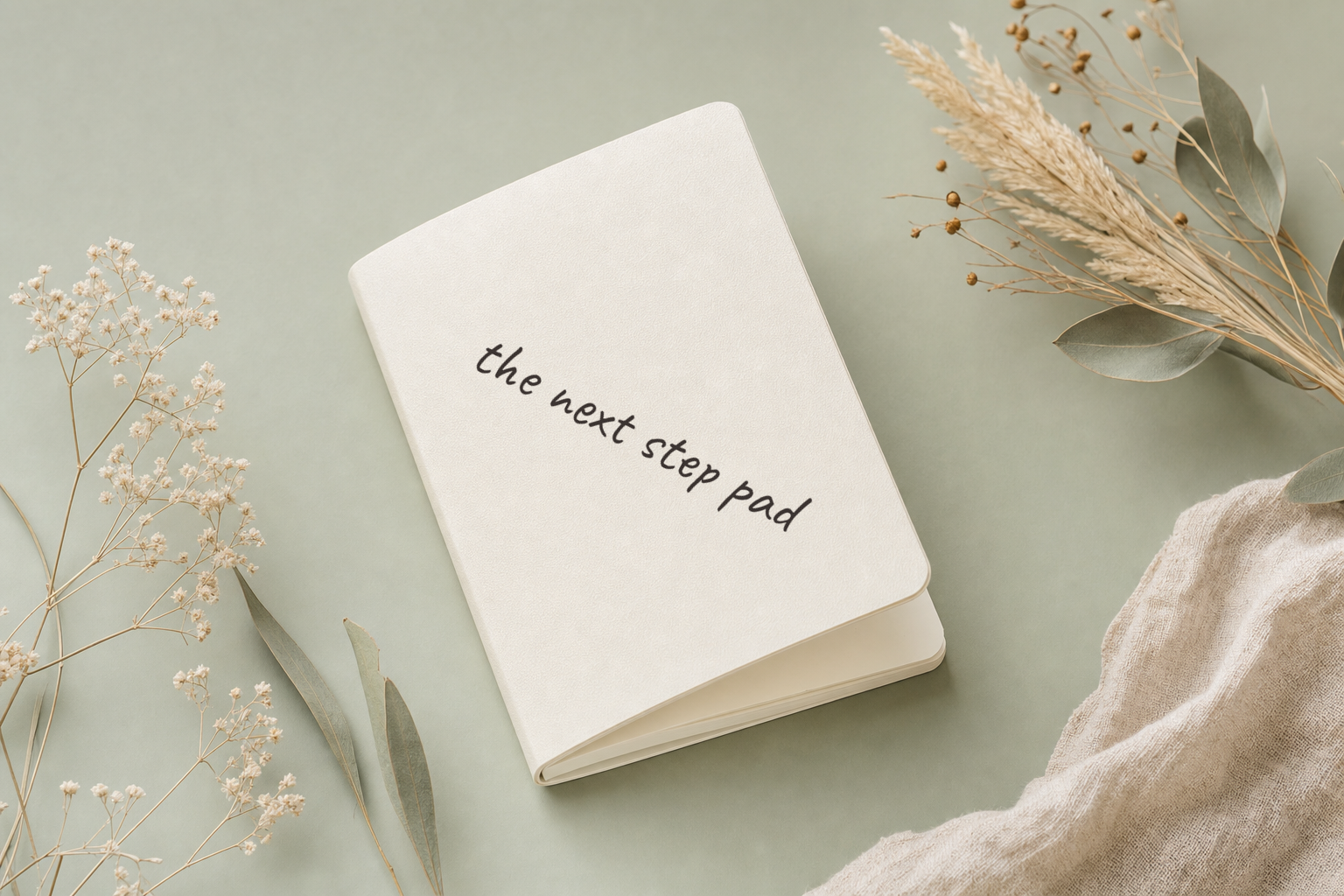 Ivory notepad with dried botanical