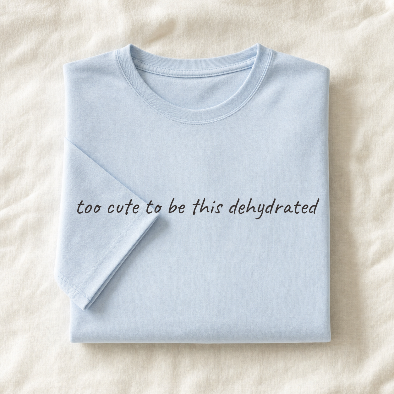 Powder blue planner tee, folded flat lay