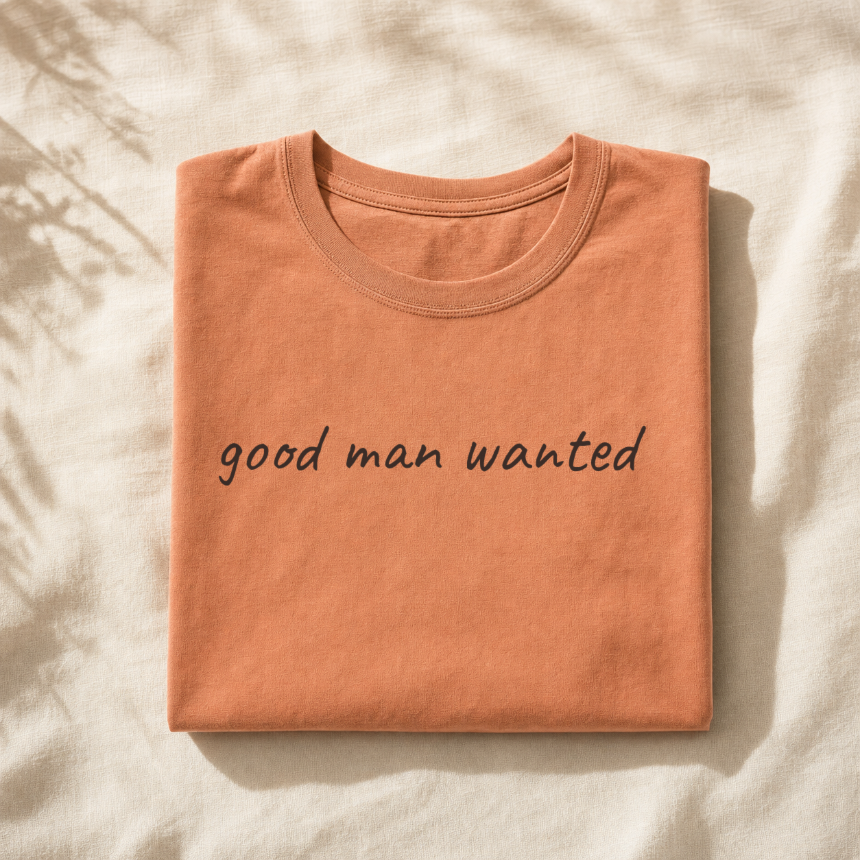 Clay terracotta planner tee, folded flat lay