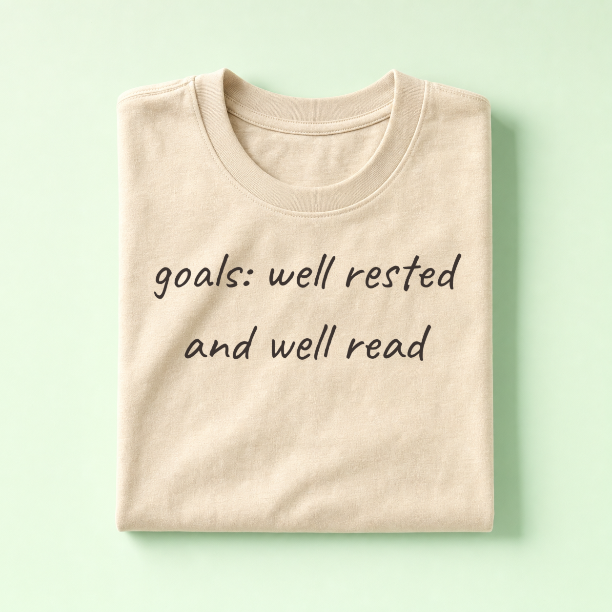 Oatmeal planner tee, folded flat lay